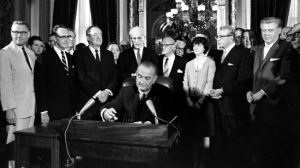 President Lyndon B. Johnson signs the Voting Rights Act of 1965