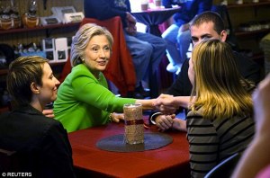 Hillary Clinton has a "spontaneous" conversation with patrons at a coffee shop in Le Claire, Iowa.