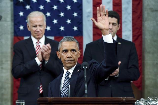 U.S. President Obama waves at the conclusion of his final State of the Union address to a joint session of Congress in Washington