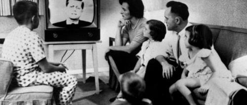 family-gathered-around-tv-500x214